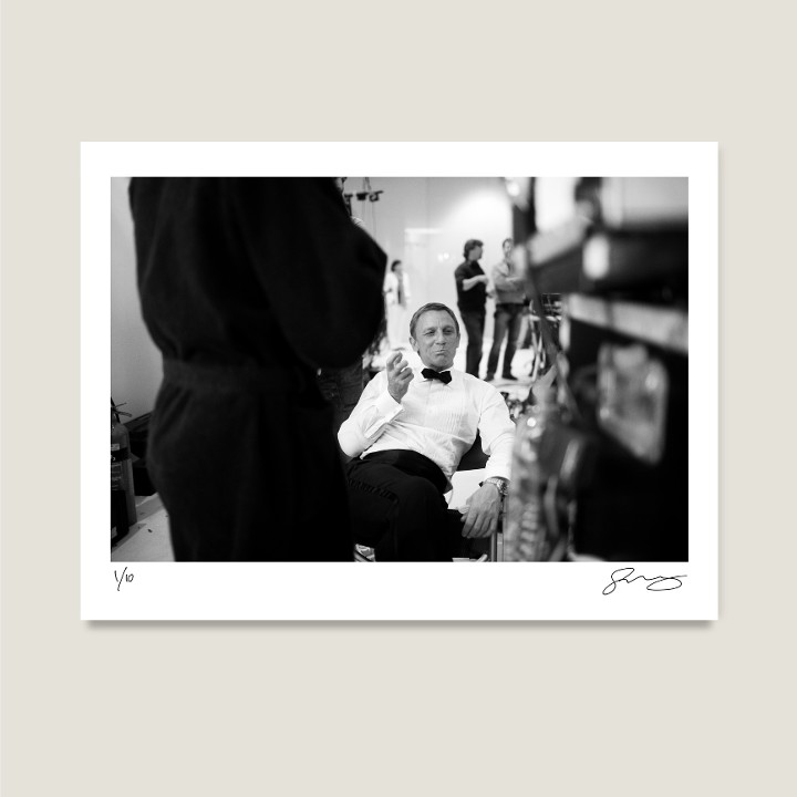 Daniel Craig jokes around in between takes on location in Bregenz, Austria. Quantum Of Solace, 2008. Archival pigment print on Hahnemühle Fine Art Baryta Satin 300gsm.

Signed Limited Edition Price increases with every sold unit.