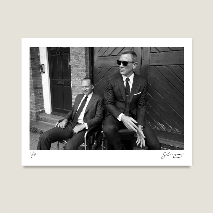 Ralph Fiennes and Daniel Craig on location in London. No Time To Die, 2019. Archival pigment print on Hahnemühle Fine Art Baryta Satin 300gsm.

Signed Limited Edition Price increases with every sold unit.