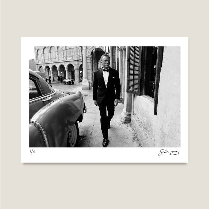 Daniel Craig on the Cuba set, Pinewood Studios. No Time To Die, 2019. Archival pigment print on Hahnemühle Fine Art Baryta Satin 300gsm.

Signed Limited Edition Price increases with every sold unit.