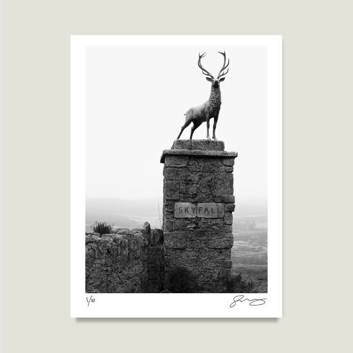 The gates to Skyfall Lodge. Shot on location at Hankley Common, Surrey. Skyfall, 2012. Archival pigment print on Hahnemühle Fine Art Baryta Satin 300gsm.

Signed Limited Edition Price increases with every sold unit.